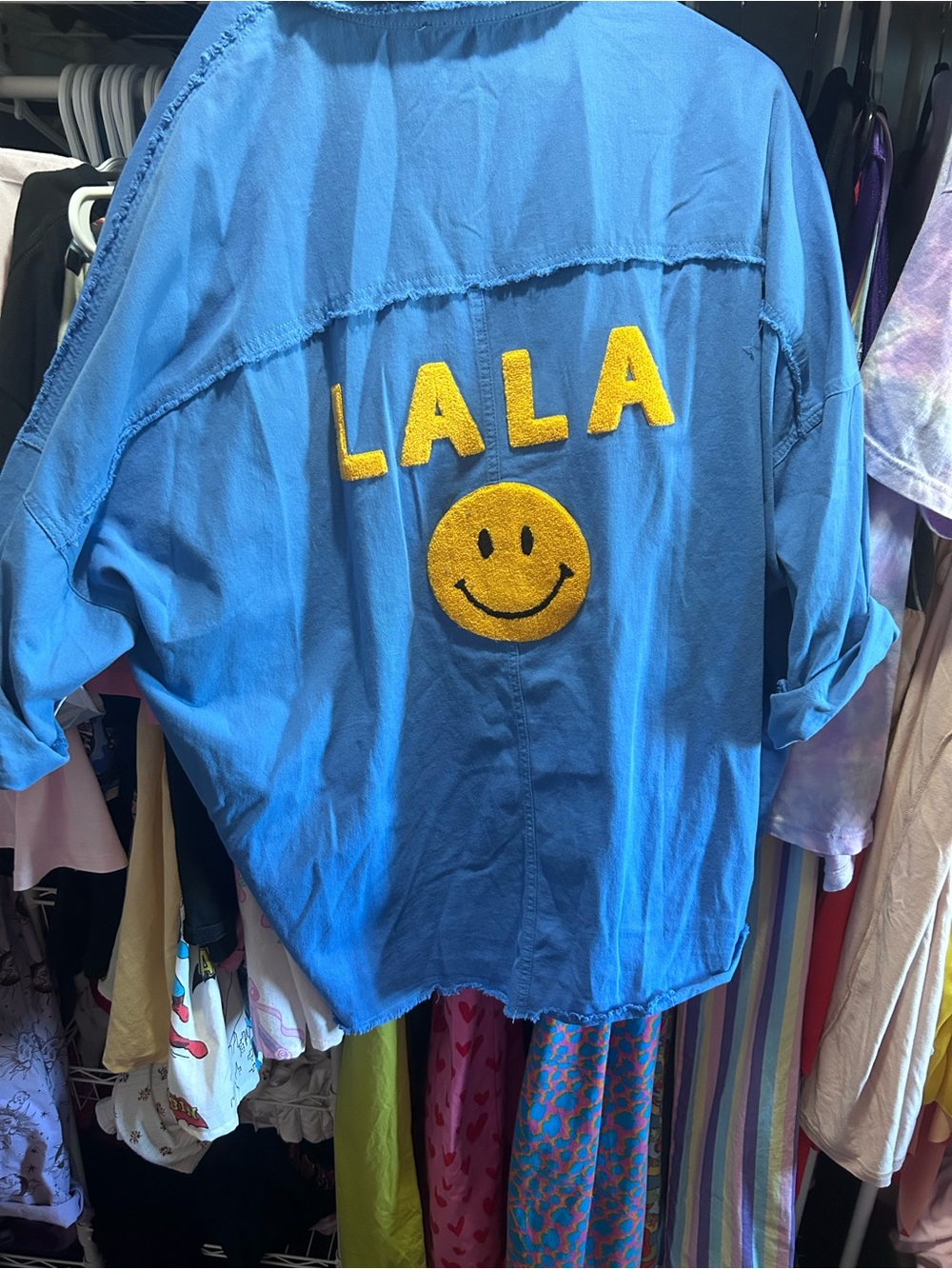 Dressed in LALA Blue Shacket with Yellow Smiley Patch